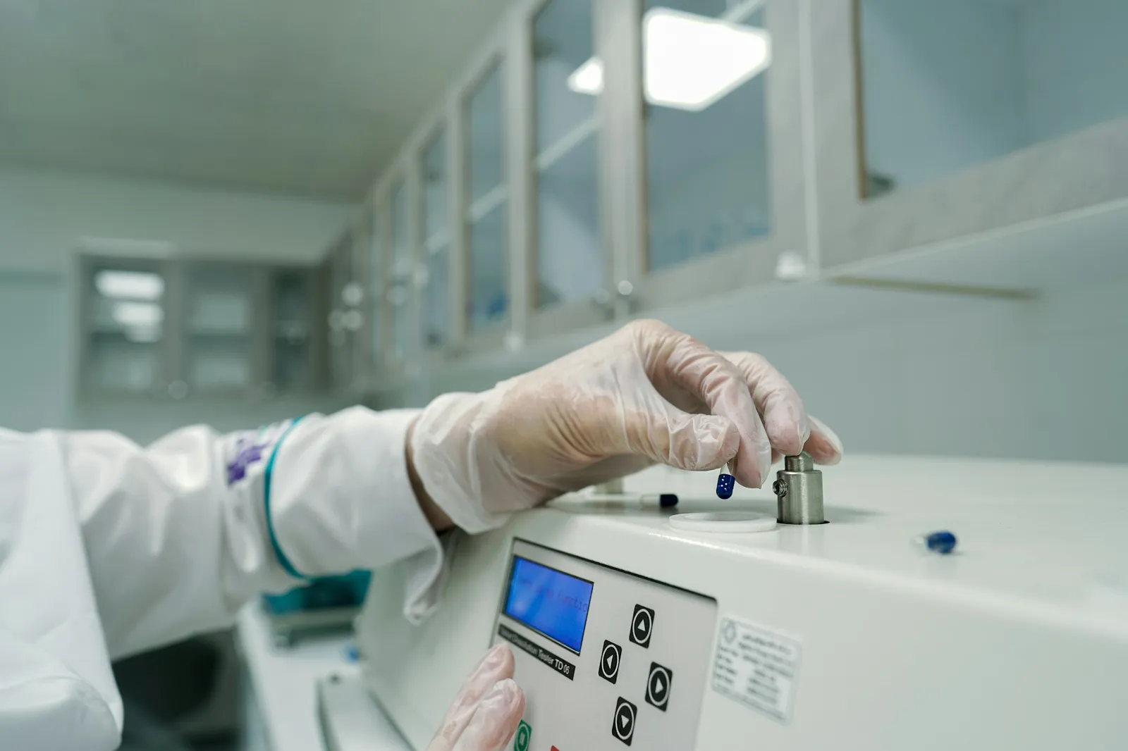 Analyst loading samples into a laboratory instrument